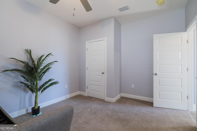 sitting room with light carpet and ceiling fan