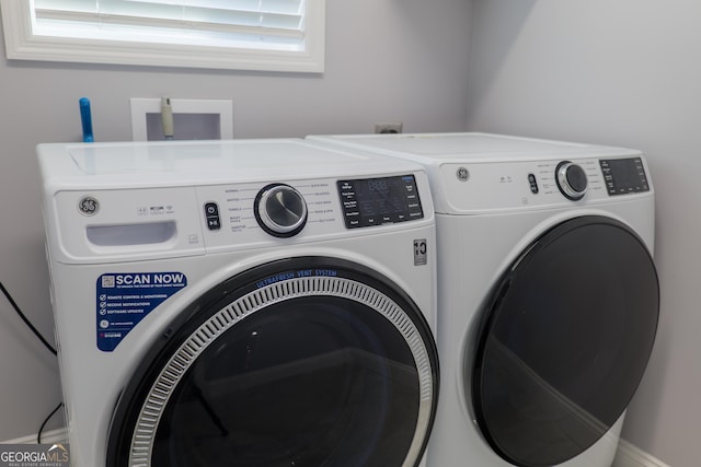 laundry room featuring separate washer and dryer