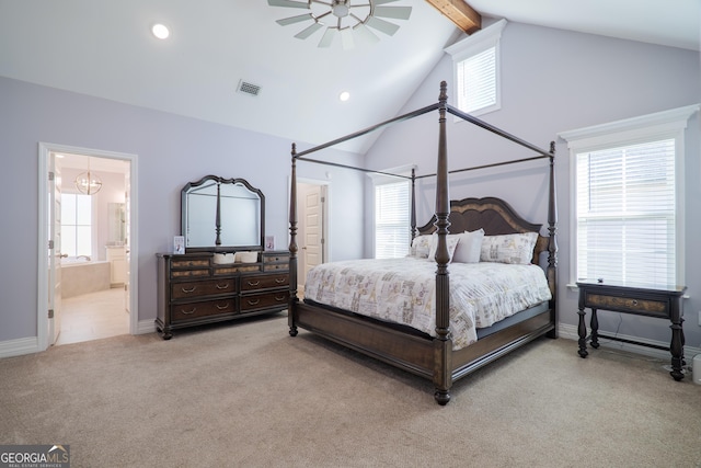 carpeted bedroom featuring lofted ceiling with beams, connected bathroom, and ceiling fan