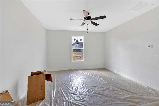 unfurnished room featuring ceiling fan