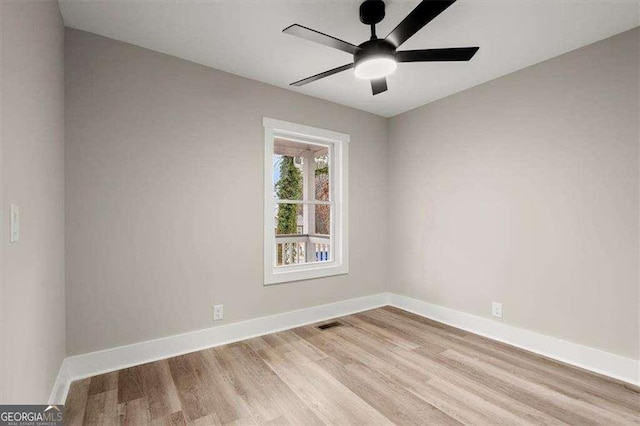 empty room with light hardwood / wood-style floors and ceiling fan