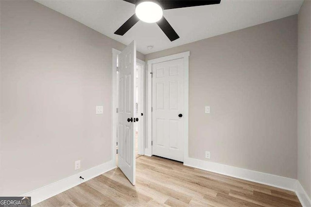 unfurnished bedroom featuring light hardwood / wood-style floors and ceiling fan