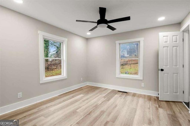 unfurnished room with light hardwood / wood-style floors and ceiling fan