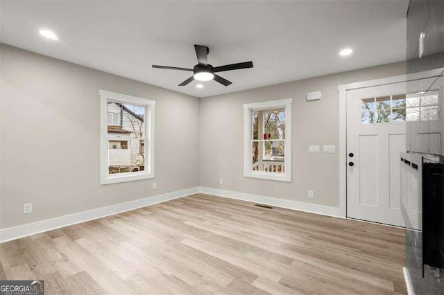 foyer entrance featuring ceiling fan and light hardwood / wood-style flooring