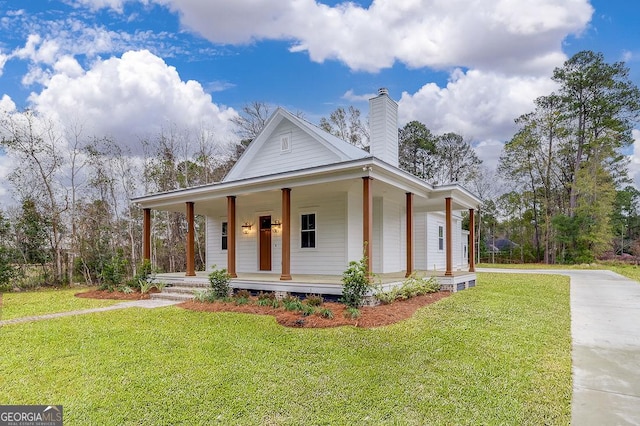 farmhouse-style home with a porch and a front lawn