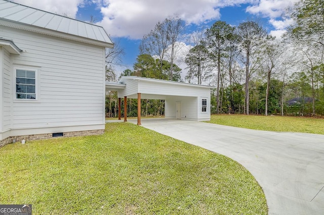 exterior space featuring a yard and a carport