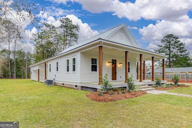 farmhouse-style home featuring a porch, a garage, and a front lawn