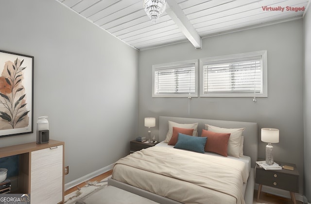 bedroom with beamed ceiling, wood-type flooring, and wooden ceiling