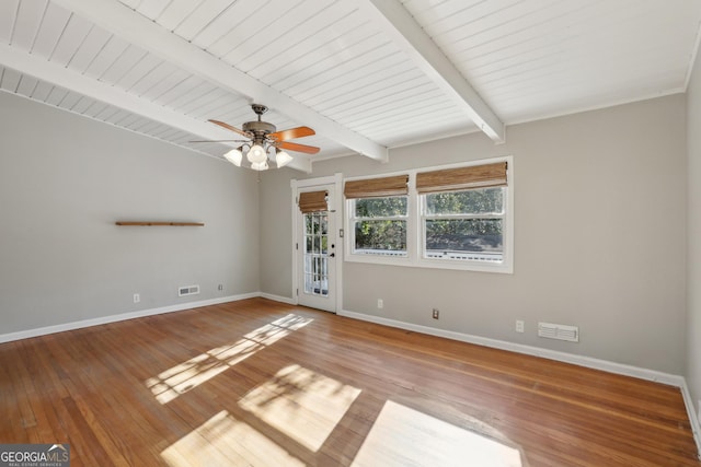 spare room with beamed ceiling, ceiling fan, and wood-type flooring