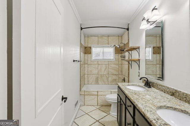 full bathroom with toilet, crown molding, tiled shower / bath, vanity, and tile patterned flooring