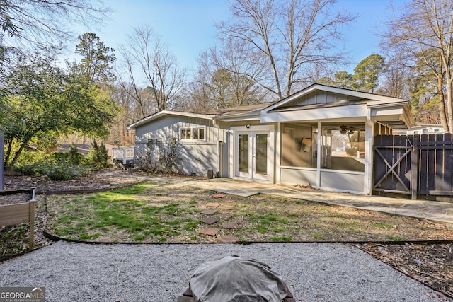 rear view of property with french doors