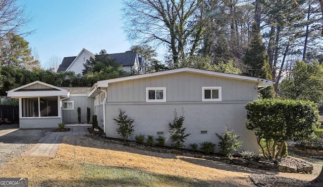 view of front facade featuring a sunroom