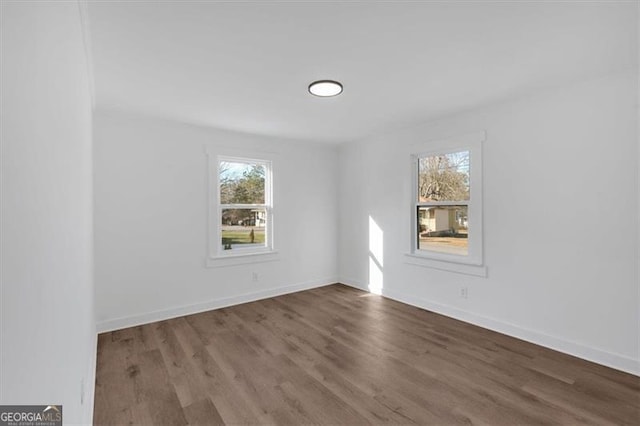 spare room with hardwood / wood-style flooring