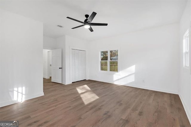 interior space featuring dark hardwood / wood-style flooring and ceiling fan