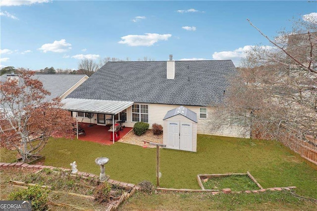 back of property with a storage shed and a yard