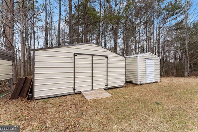 view of outbuilding with a yard