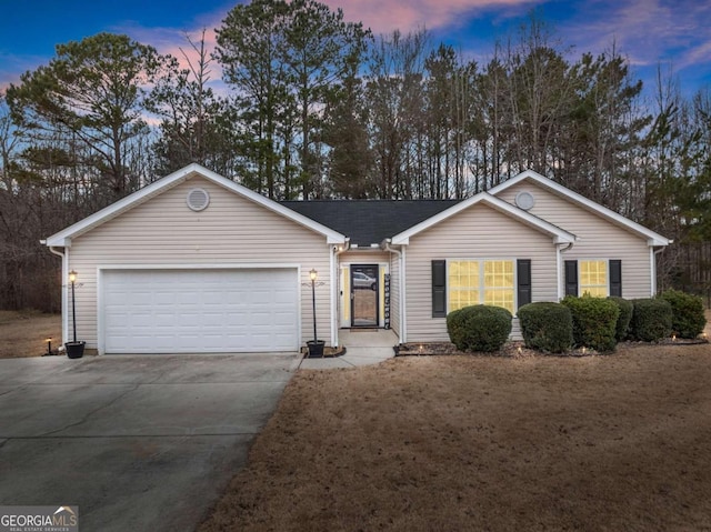 ranch-style home with a garage