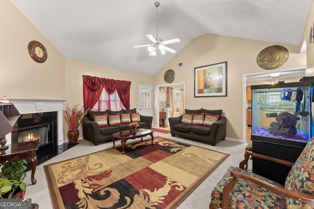 living room featuring light carpet, vaulted ceiling, and ceiling fan