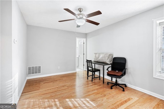 sitting room featuring hardwood / wood-style floors and ceiling fan