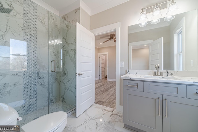 full bath with a marble finish shower, toilet, marble finish floor, crown molding, and vanity