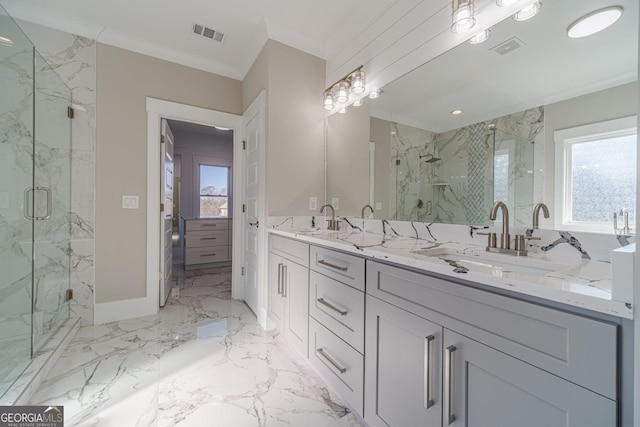 full bathroom featuring marble finish floor, a marble finish shower, visible vents, and a sink