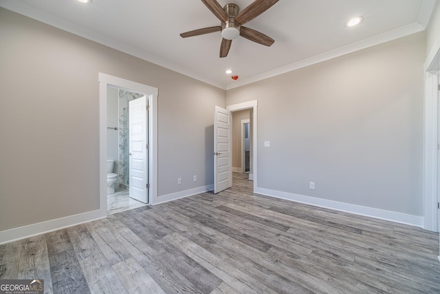 1785 Traditions Way, Jefferson, GA 30549 - unfurnished bedroom featuring wood finished floors, recessed lighting, baseboards, crown molding, and ensuite bathroom