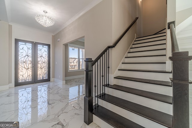 entryway with french doors, marble finish floor, crown molding, baseboards, and stairs