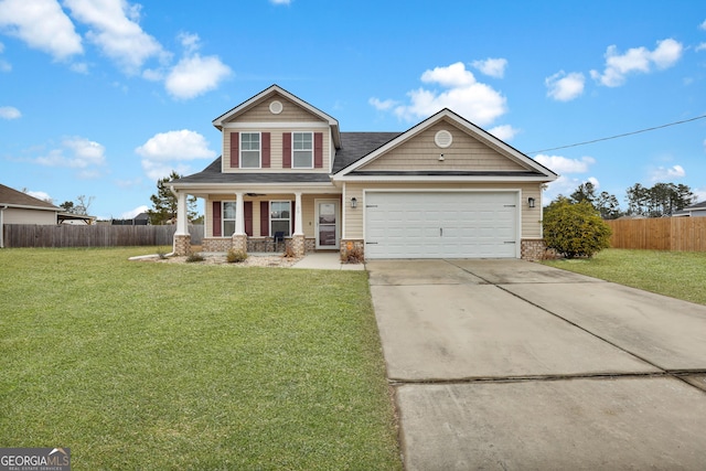 view of front facade with a garage, covered porch, and a front lawn