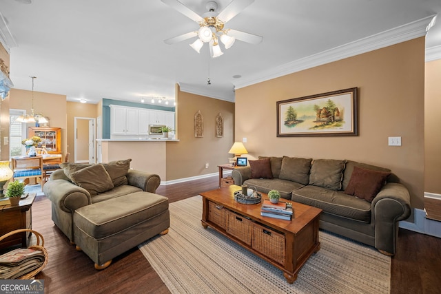 living room featuring ornamental molding, ceiling fan with notable chandelier, and light hardwood / wood-style floors