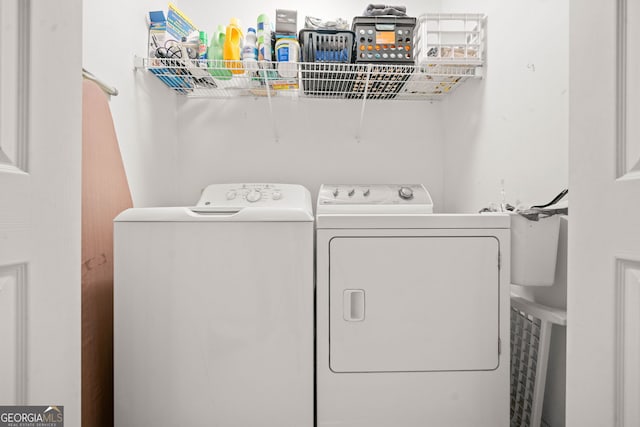 laundry room featuring washing machine and clothes dryer