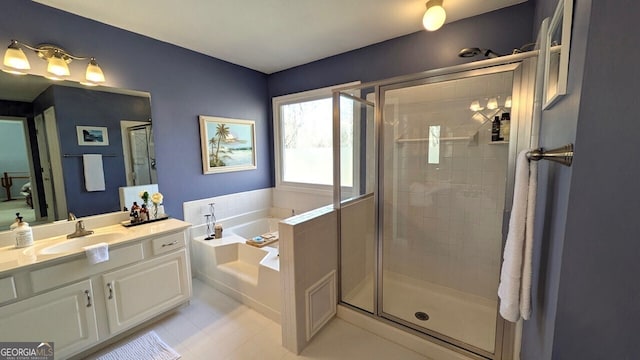 bathroom featuring vanity and shower with separate bathtub