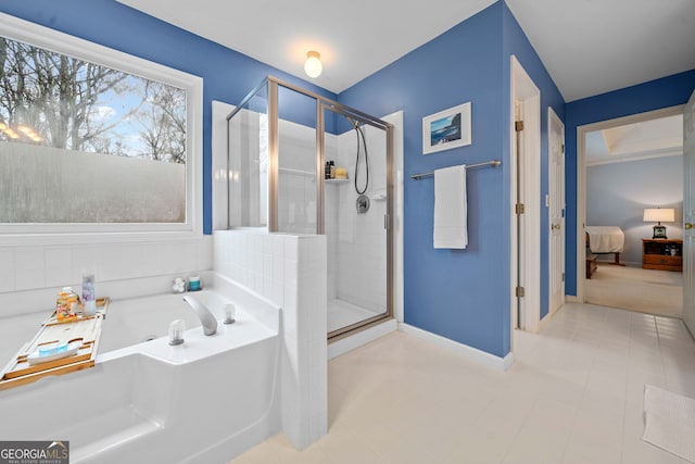 bathroom with shower with separate bathtub