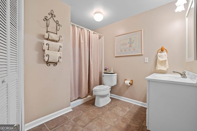 bathroom with vanity, walk in shower, and toilet