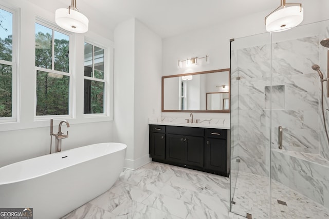 bathroom featuring vanity and independent shower and bath