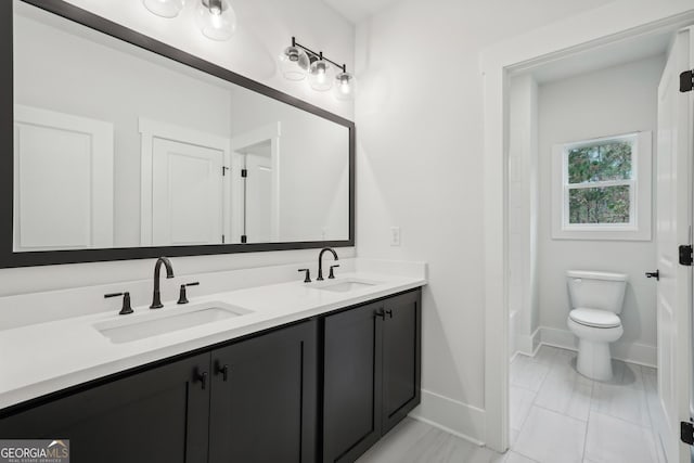 bathroom with vanity and toilet