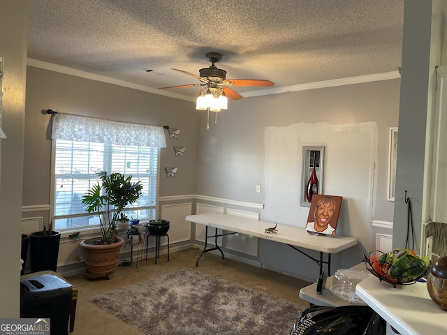 office featuring ceiling fan, crown molding, and a textured ceiling