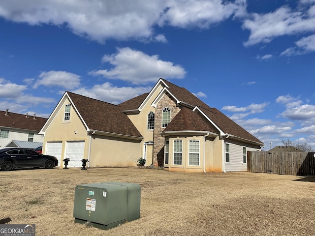 view of front of property with a garage