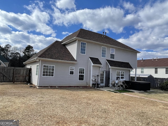 rear view of property with a patio area and a lawn