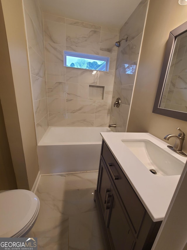 full bathroom featuring vanity, toilet, and tiled shower / bath combo