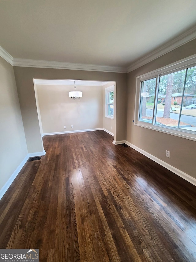 spare room with dark wood-type flooring, a wall mounted air conditioner, and crown molding