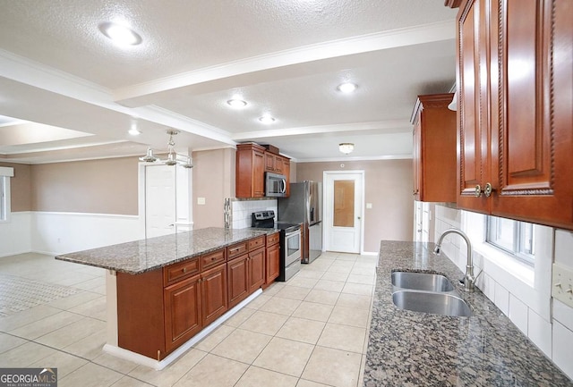 kitchen featuring sink, crown molding, dark stone counters, and appliances with stainless steel finishes