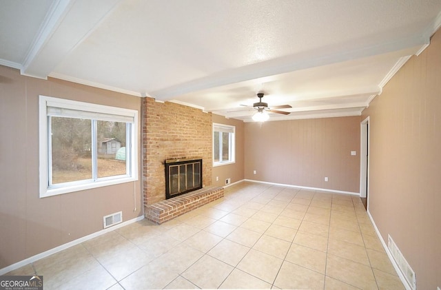 unfurnished living room with light tile patterned floors, ornamental molding, and beamed ceiling