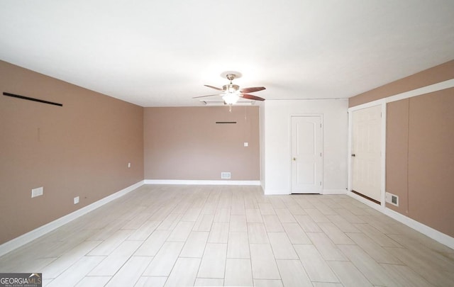 spare room with ceiling fan