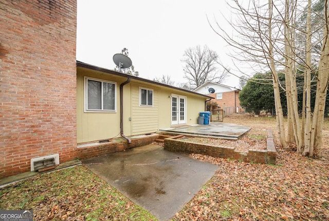 rear view of property with a patio and french doors