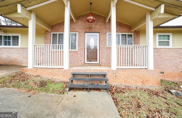 property entrance with covered porch