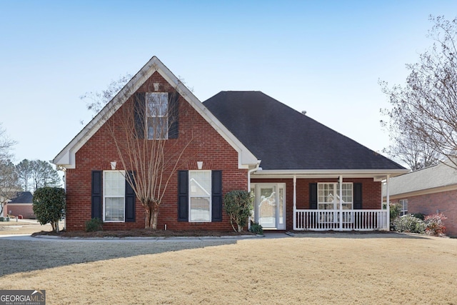 view of front facade with a porch and a front lawn