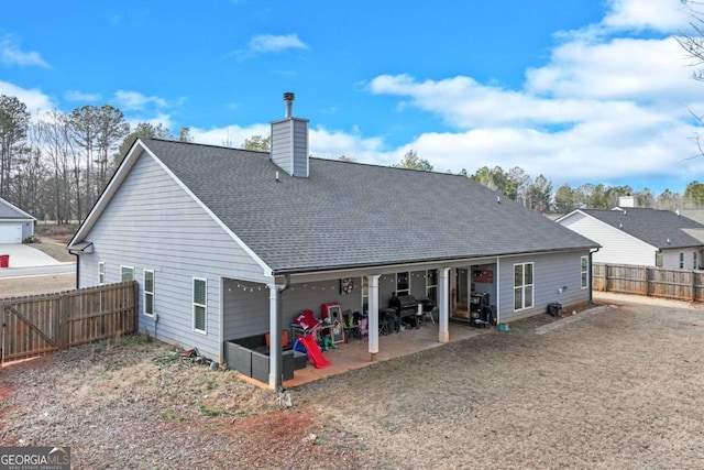 back of house with a patio