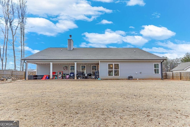 back of property with a patio area