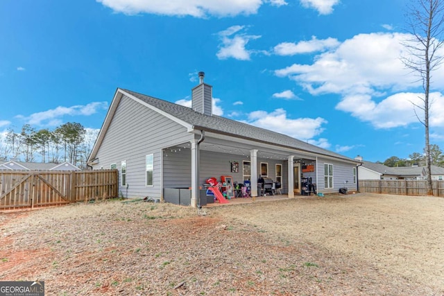 rear view of house featuring a patio