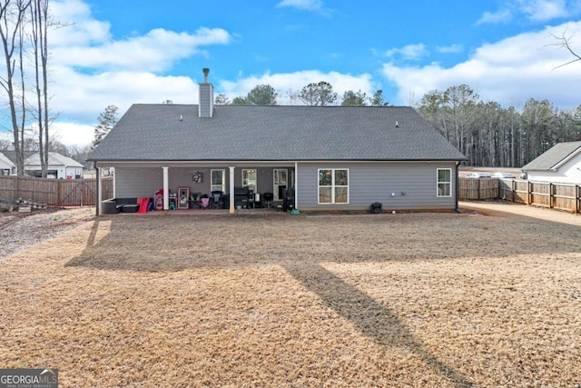 back of property with a patio area